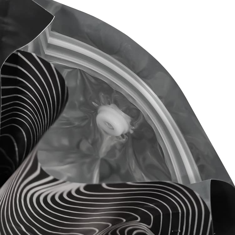 Inside view of an opened flat bottom coffee bag showing the resealable zipper and degassing valve