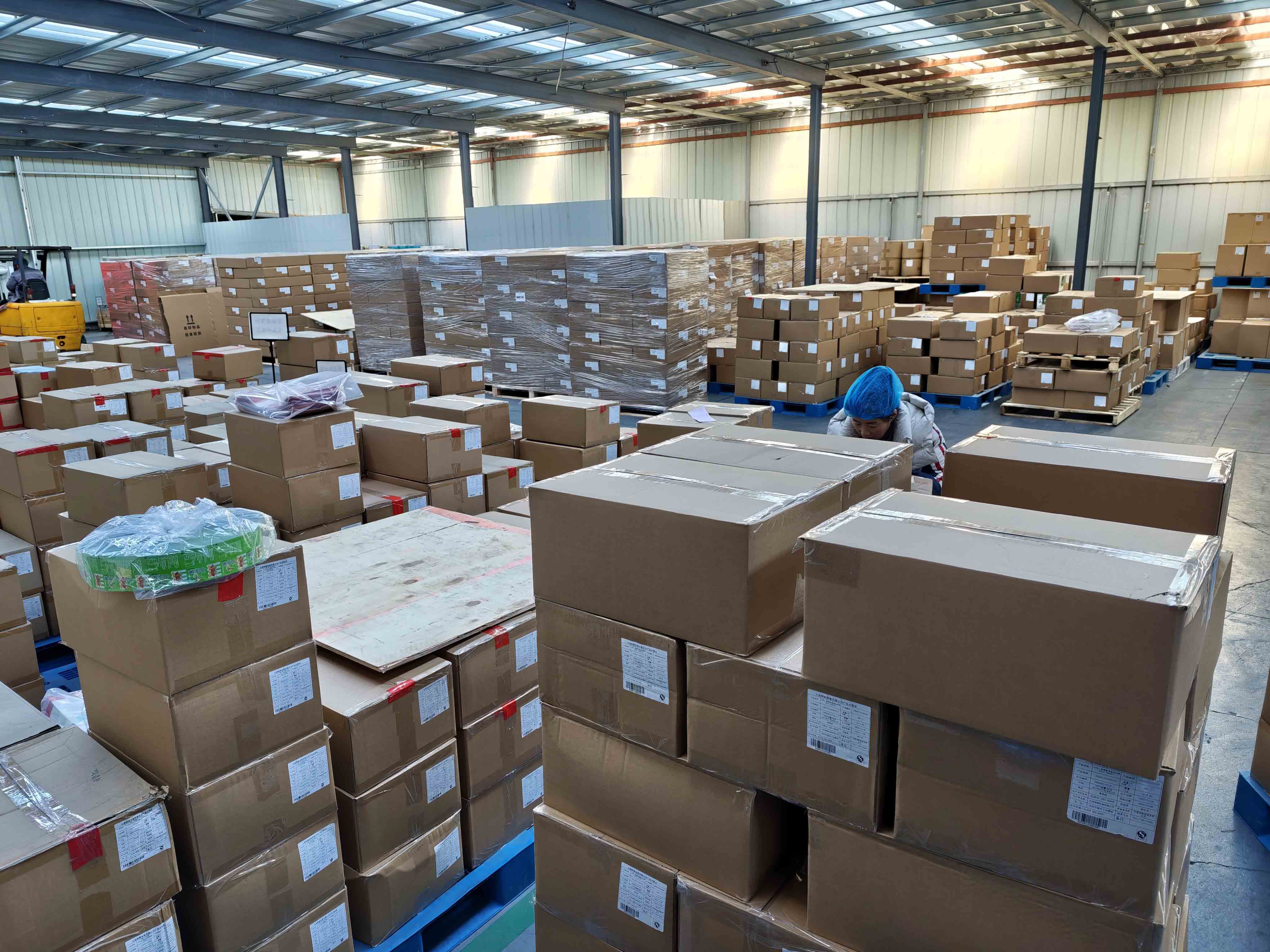 Finished cartons arranged on pallets in a packaging warehouse