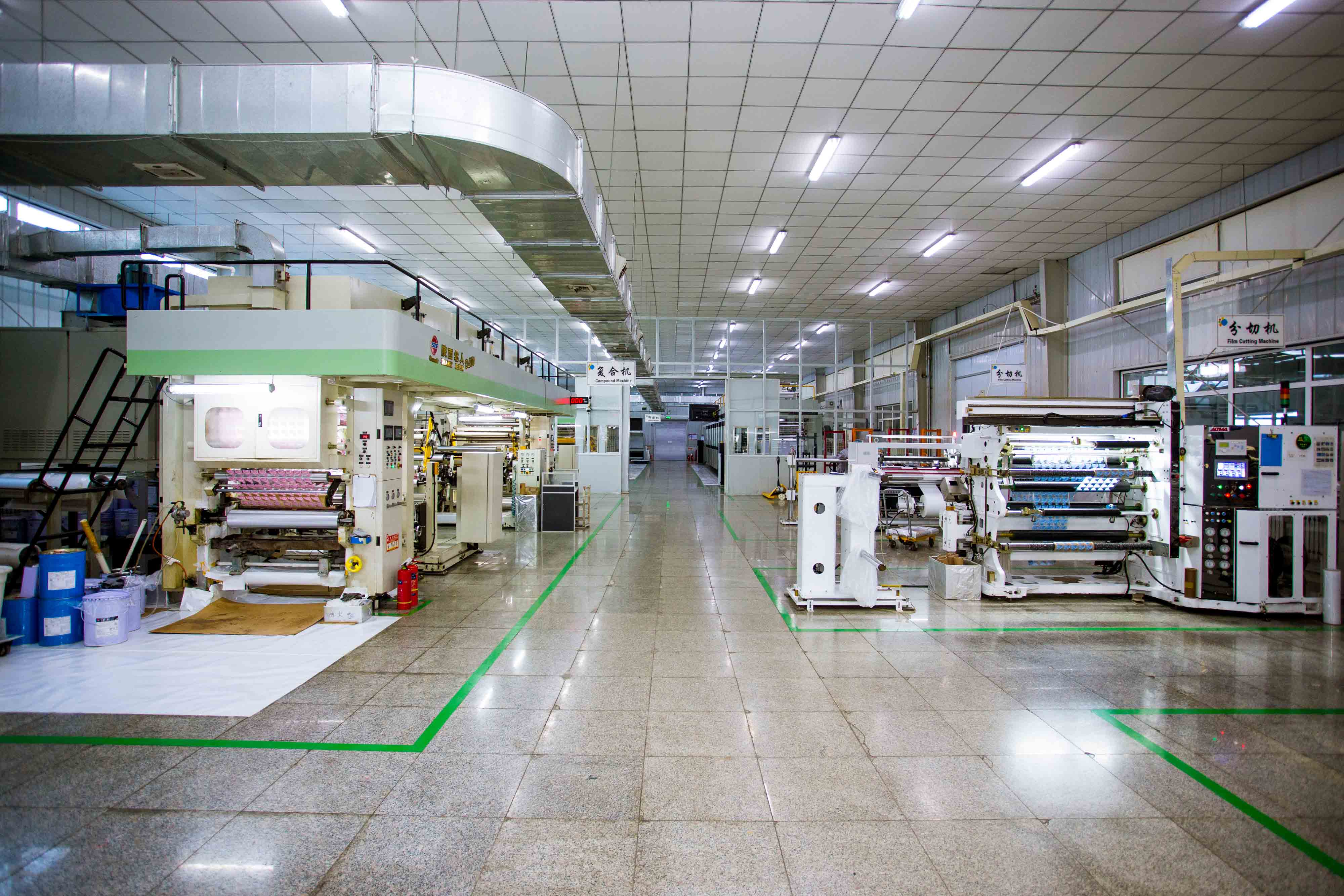 Wide view of flexible packaging production equipment in the workshop