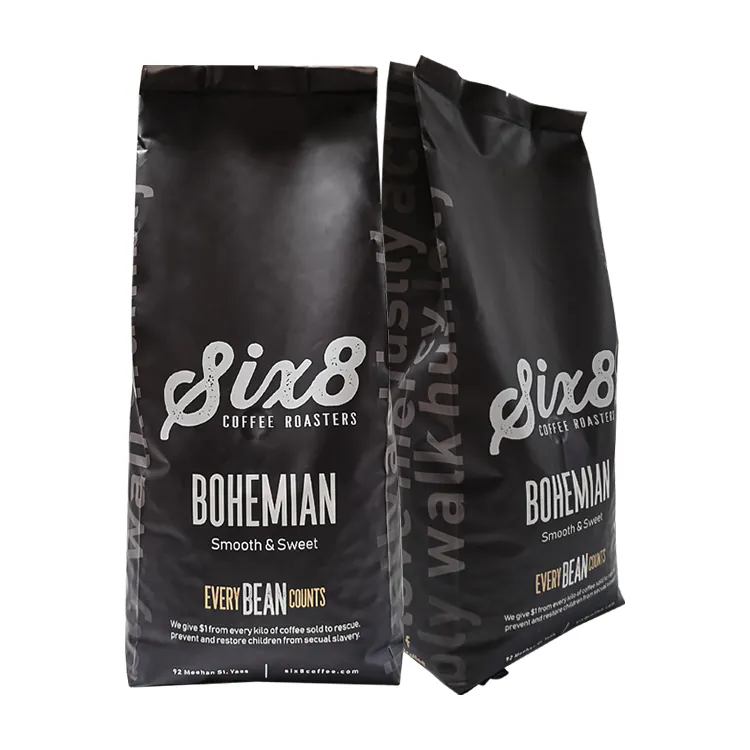 Black side gusset coffee bags shown from front and side with typography continuing onto the gusset
