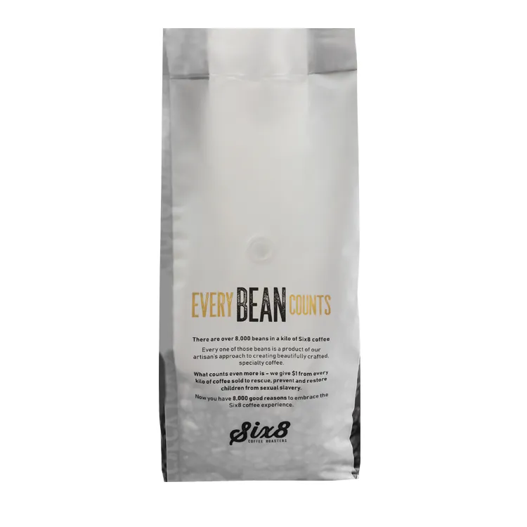 Back of a side gusset coffee bag showing a one-way valve below the sealed top area