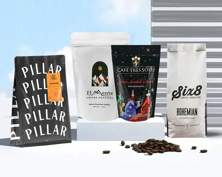 Four custom printed coffee bags in different formats displayed with coffee beans