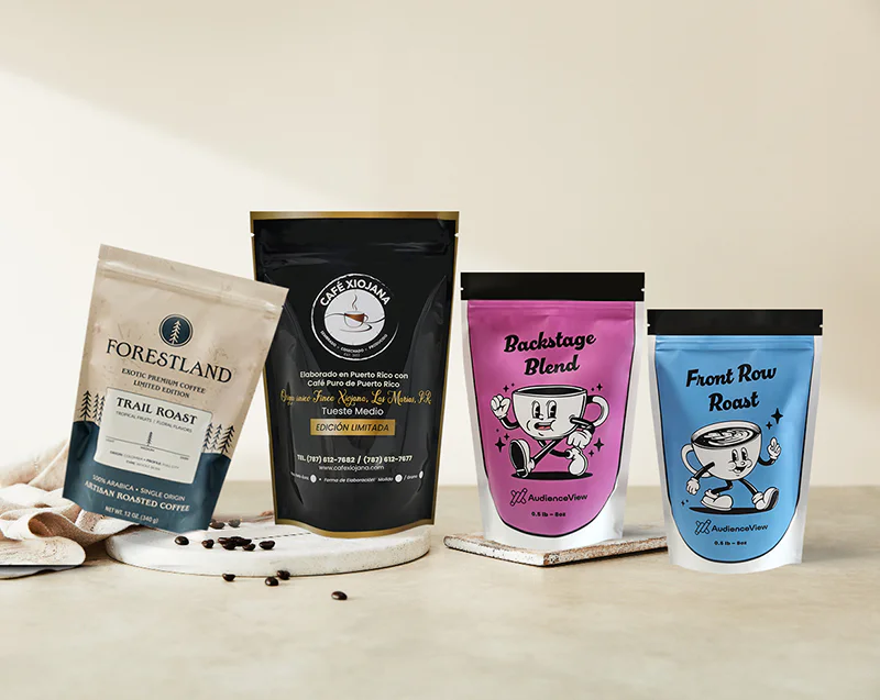 Four custom printed stand-up coffee pouches displayed on a neutral background